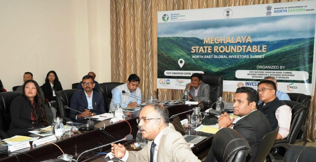 Roundtable session at the Meghalaya State Convention Centre with North East Global Investors Summit branding on stage